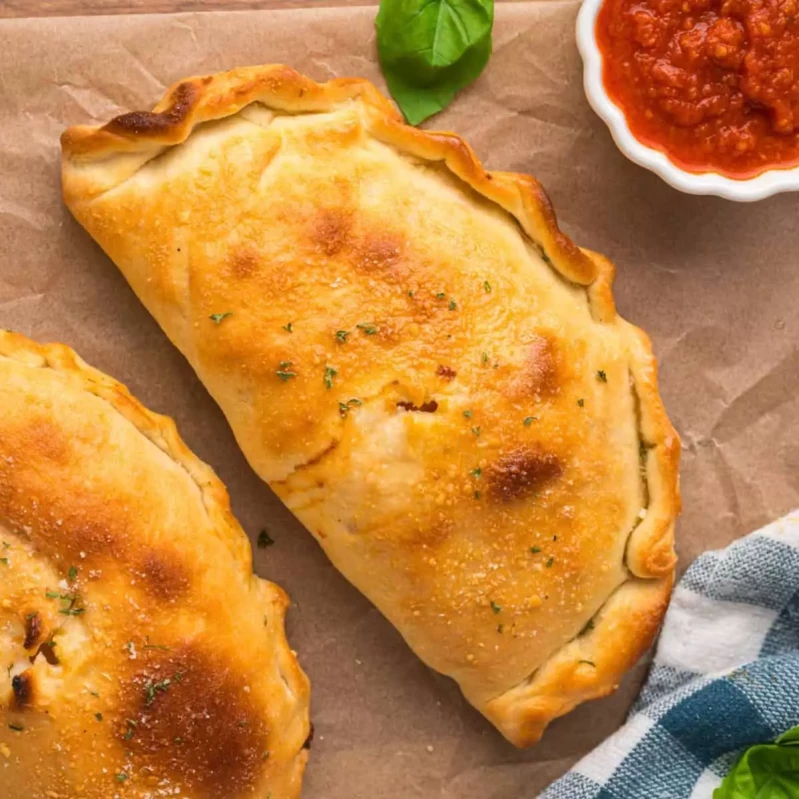 Halal Calzone — folded pizza pocket stuffed with halal meats at Aladin's Pizzeria Winnipeg