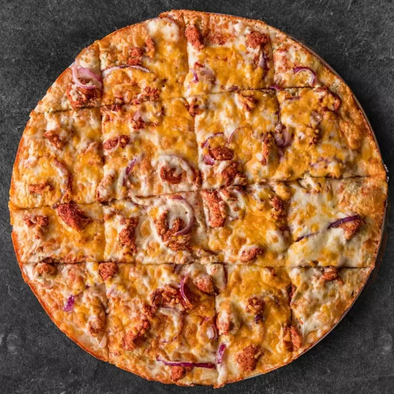 Aladin's Tandoori Chicken Pizza Winnipeg — halal pizza topped with tandoori-marinated chicken